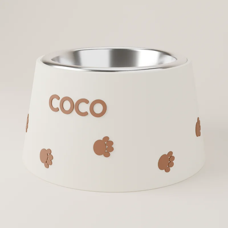 Comedero Huellitas crema con huellitas marrones y el nombre Coco